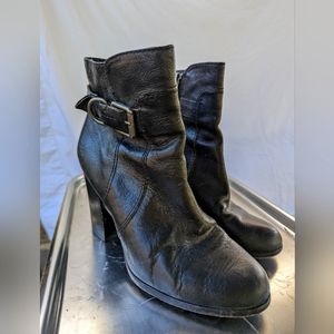 Sleek black vintage Frye high-heeled ankle boots